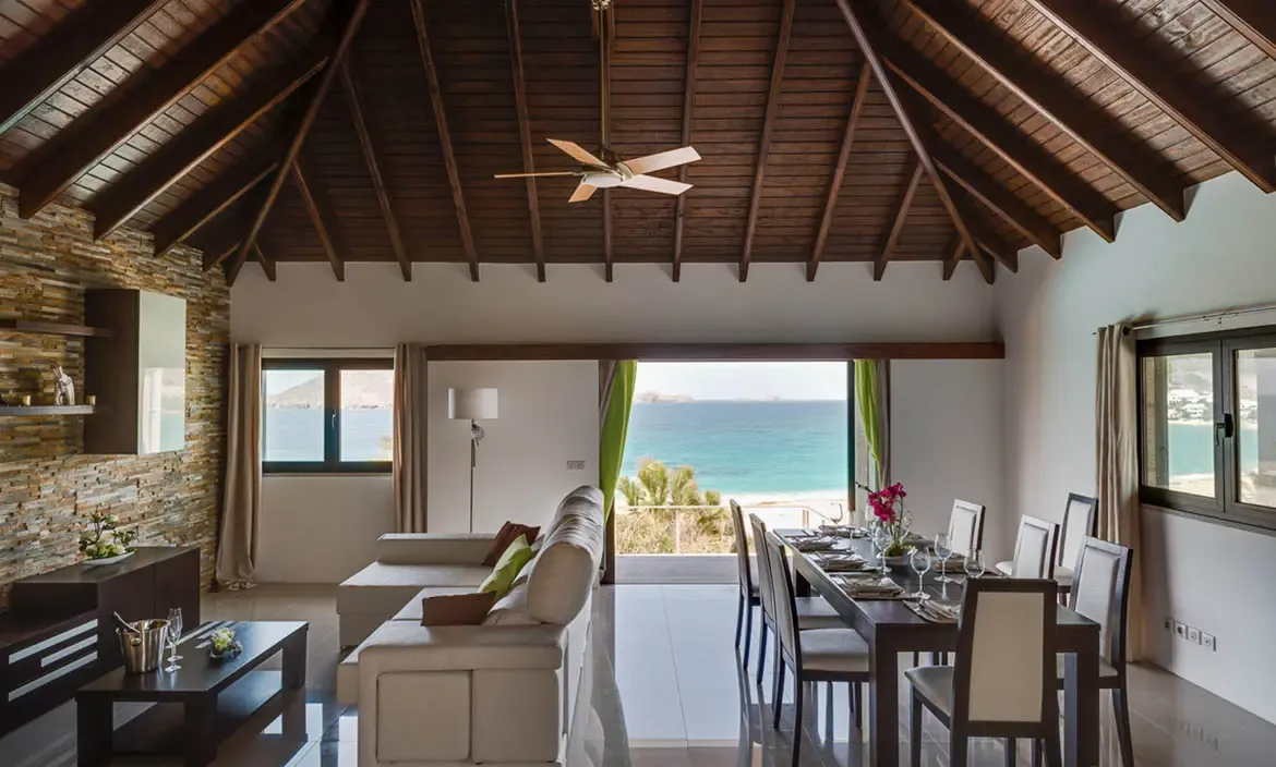 An open-concept design allows the sea breeze to flow through the elegant dining and lounge areas, creating a seamless connection with the ocean horizon.
