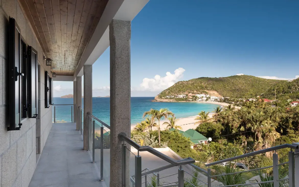 Wake up to breathtaking panoramas of Gouverneur Bay from the villa's expansive gallery, where the Caribbean blue meets lush tropical hills.