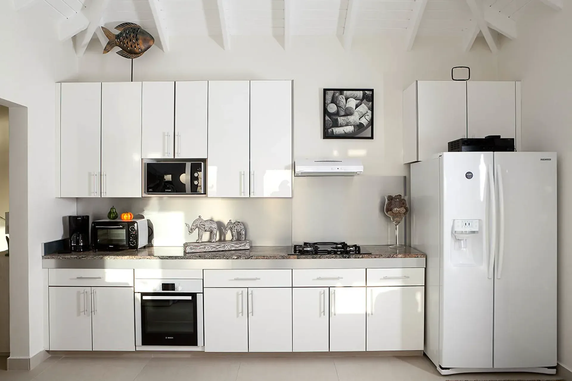Kitchen with granite counters and stainless appliances.